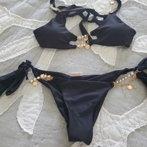 Bahimi bathing suit. Top is a medium and bottom is xs.